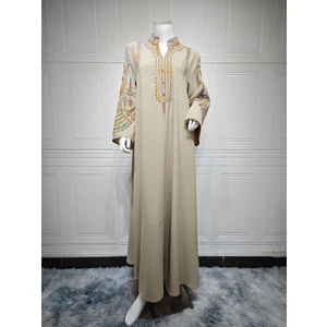 Beige AB420 dress on a mannequin showing the full embroidered front