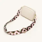 Pink, olive and white patterned strap attached to a small cream crossbody bag