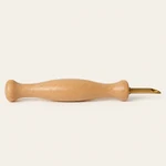 Close view of the wooden handle and metal tip of the punch needle.