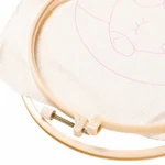 Close-up of the plastic hoop screw fastener beside printed fabric.