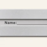 Close-up of the luggage tag window showing the Name label and writing line