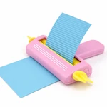 Pink crimper guiding blue paper through the rollers, with a wavy strip emerging