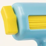 Close view of the yellow roller and side knob within the blue plastic housing