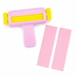 Pink crimper beside narrow strips with a pressed wave texture
