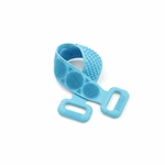 Fascia blu in silicone ripiegata su se stessa, con zone circolari di setole, punti arrotondati e due maniglie visibili.