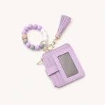 Lavender card holder with matching bead wristlet and tassel, angled view