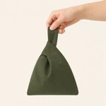 Dark green cotton knot wristlet carried by its longer loop