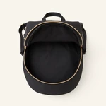 Top view into the open black backpack showing the empty main compartment and curved zipper opening