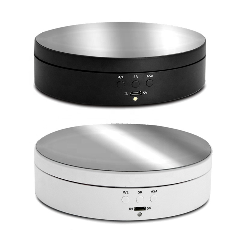 Original supplier photograph showing black and white rotating display stands