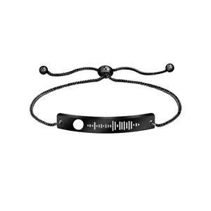 Black bracelet with light music-code engraving on white