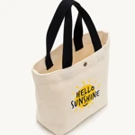Black-handled canvas tote showing sun print and woven texture