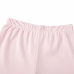 Close-up of the pink shorts' elastic waistband and ribbed texture