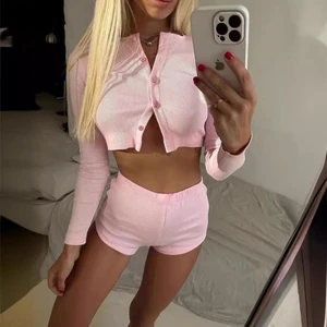 Model wearing the pink long-sleeve top and matching shorts