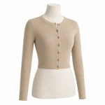 Front-angle product view of a beige cropped knit cardigan with a round neck and seven matching buttons on white