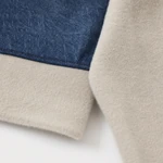 Close-up of blue denim and beige knit-style texture