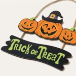 Close-up of pumpkin face and witch-hat artwork