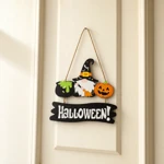 Gnome Halloween sign hanging against a cream door