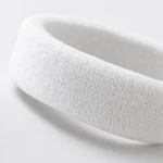 Close-up of white terry loops and soft fabric edge
