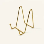 Gold iron display easel photographed from the front