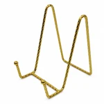 Close view of the gold bent-wire hooks and textured metal