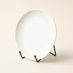 Black tabletop stand holding a plain plate as a display example