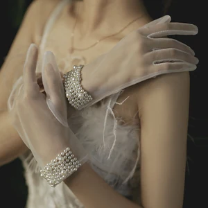 White option: one left-and-right pair of sheer full-finger gloves with wide pearl-style beaded cuffs