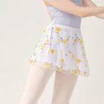 White skirt with yellow floral embroidery shown on a model