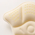 Close-up of the beige heel pad’s dotted cushion and foam edge