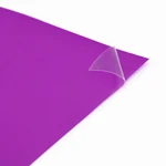 Close-up of purple puff HTV film and its clear carrier layer against white.