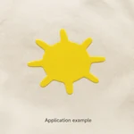 Raised yellow sun-shaped motif on cream fabric, shown as an application example; fabric not included.