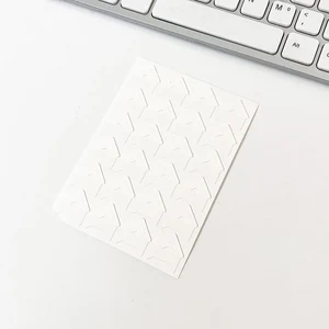 White sheet with 24 white photo corners