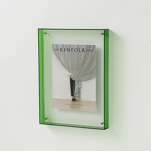 Green-edged frame displaying sample magazine artwork