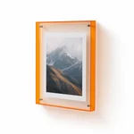 Orange-edged acrylic frame displaying a mountain photo