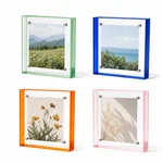Four acrylic frames with green, blue, orange and pale pink edges