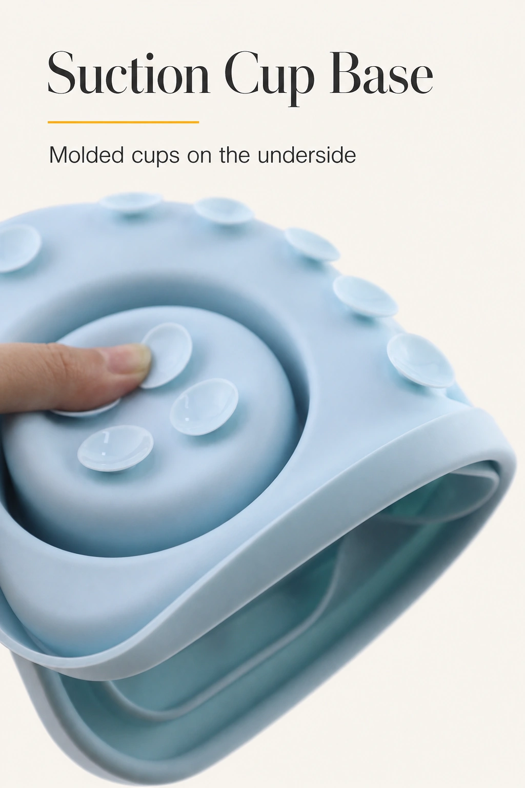 Underside of the light blue silicone mat being pressed to show its molded suction cups