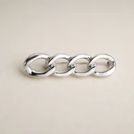 Close view of the silver linked metal contours