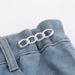 Silver chain clip positioned across a jeans waist