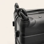 Single spinner wheel and textured black shell corner in close-up