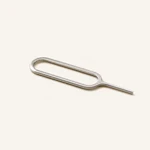 Metal SIM eject pin lying diagonally with an elongated loop handle and a thin pointed shaft