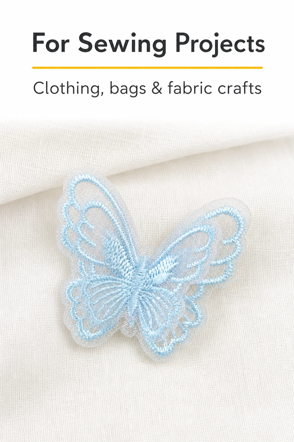 Blue embroidered butterfly appliqué displayed on fabric as a decorative accent.