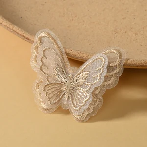 Coffee-color butterfly appliqué option shown against a warm tan background.