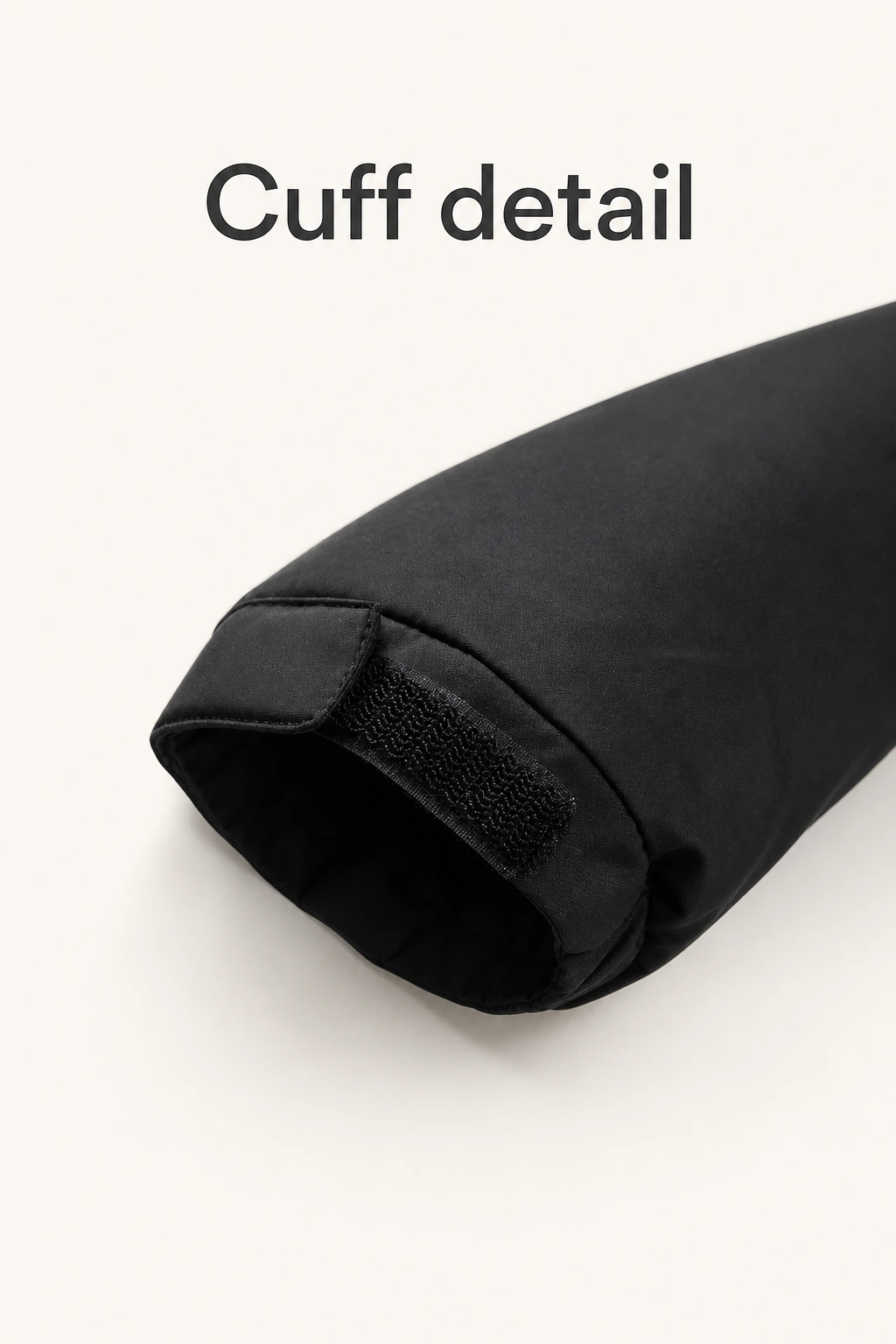 Product graphic showing the outer sleeve cuff and its textured fastening tab.