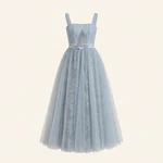 Blue lace midi evening dress on a headless display form, showing its straight neckline, diagonal sheer bodice, floral waist detail, and layered skirt.