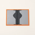 Opened orange cover with black center and gray sleeve panels