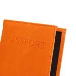 Macro of orange PU grain and PASSPORT imprint