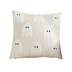 Cream cover with large white ghosts and black eyes