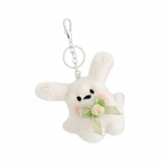 White rabbit plush keychain with pale green bow and cream flower on white