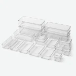 Clear drawer organizer trays in assorted rectangular and square sizes