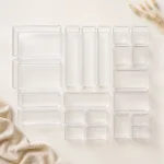 Overhead layout of empty clear drawer trays in different sizes