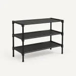Angled view of an empty black shoe rack showing three shelves and four legs